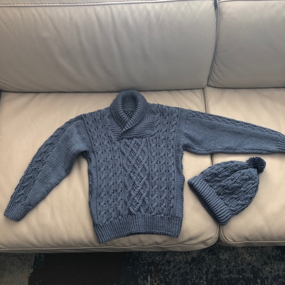 Home knit kids shawl sweater and matching hat.